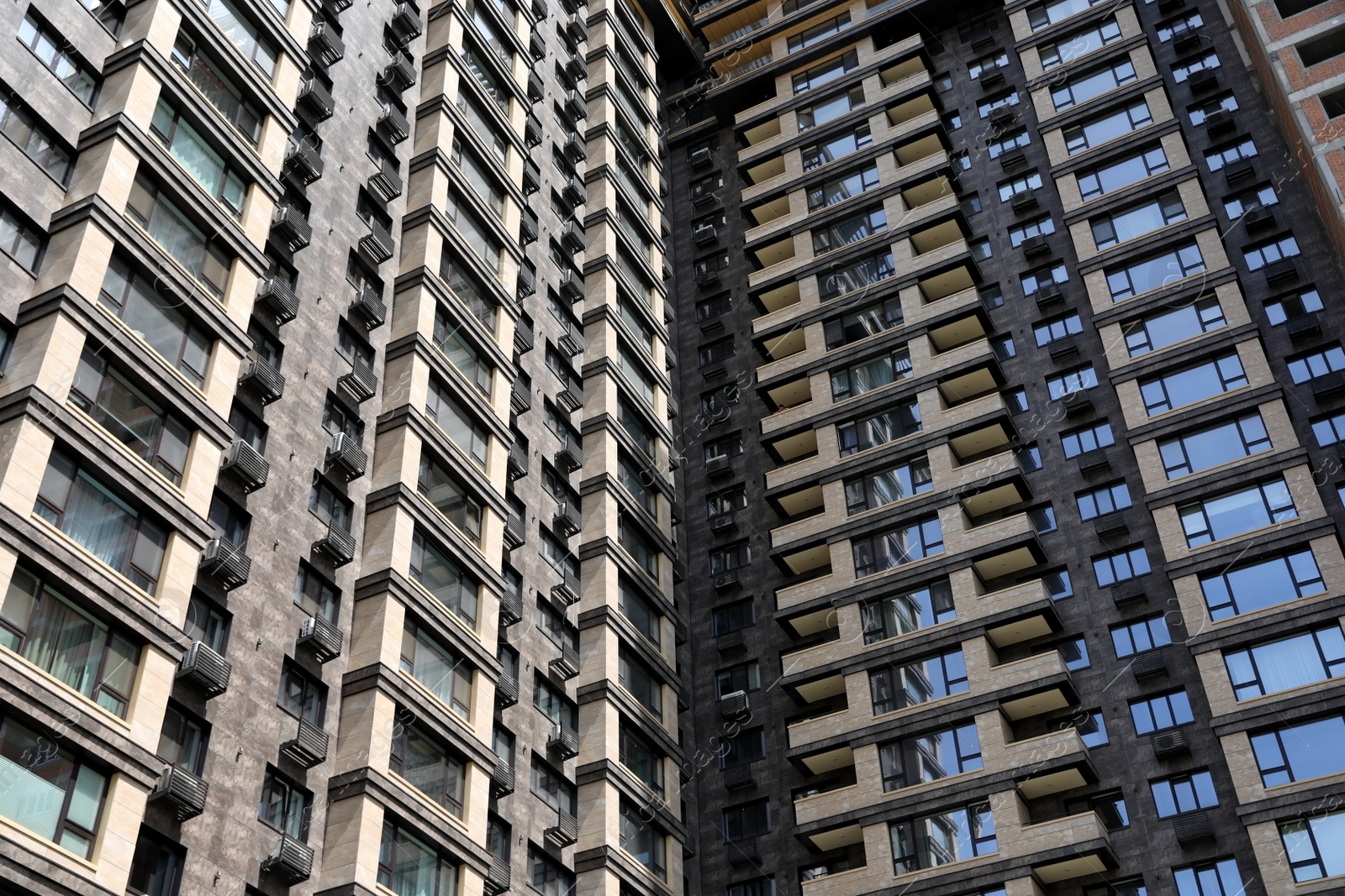 Photo of Low angle view of modern building as background