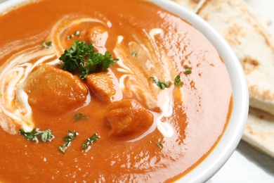 Delicious butter chicken in bowl, closeup. Traditional Murgh Makhani dish