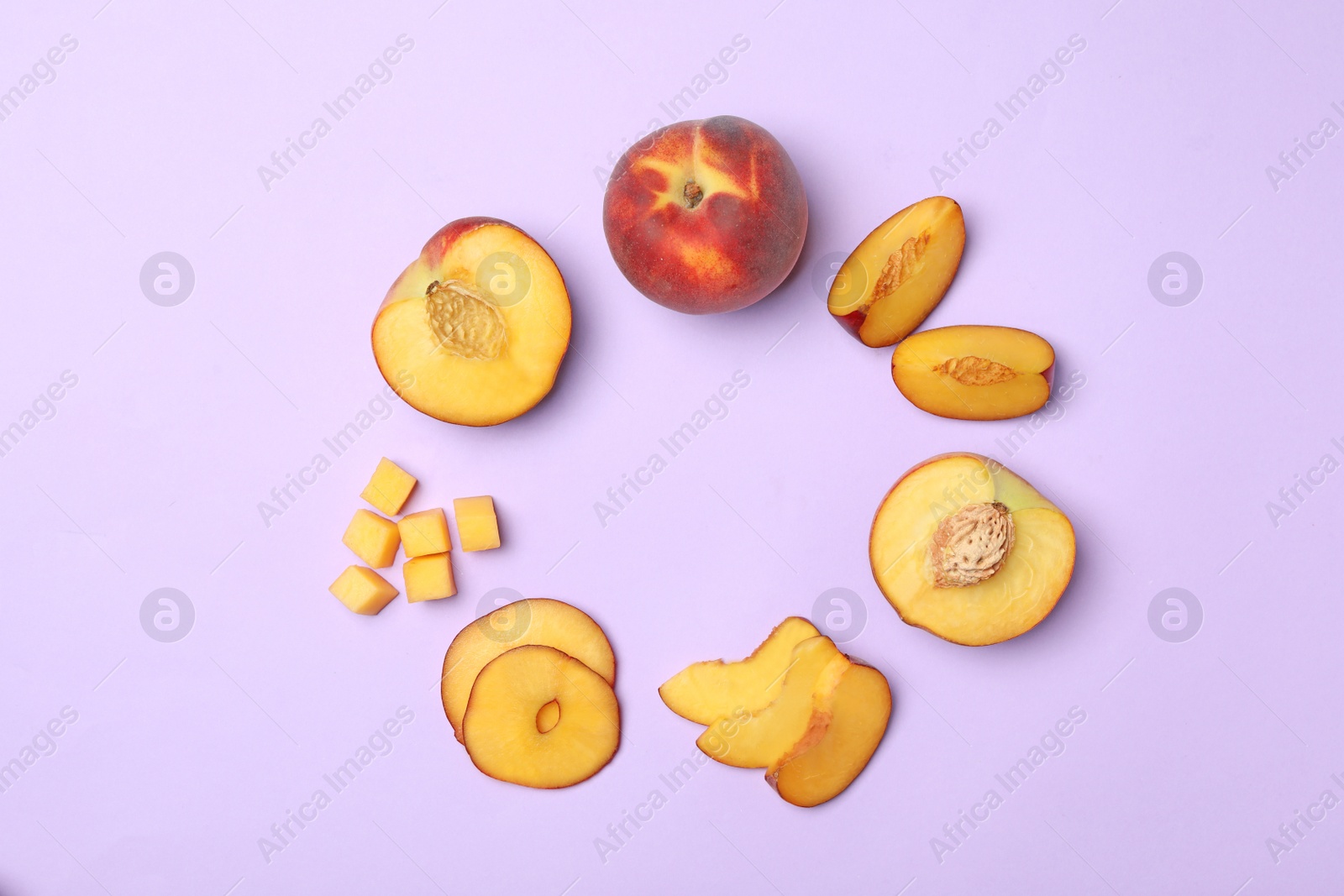 Photo of Frame made of sweet juicy peaches on lilac background, flat lay. Space for text