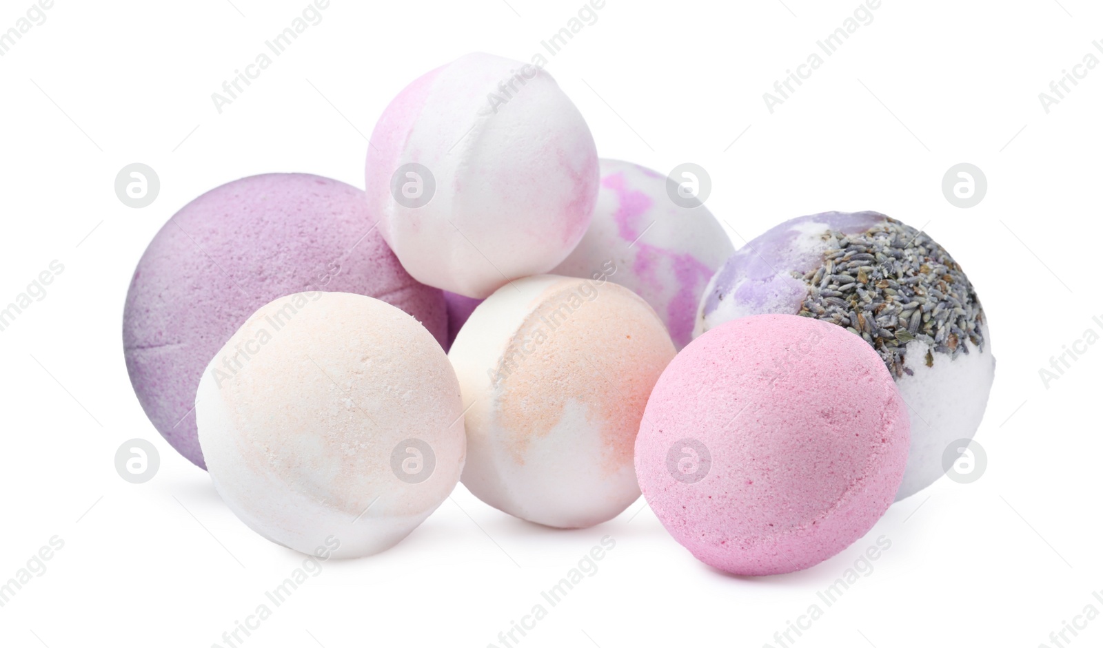 Photo of Many colorful bath bombs on white background