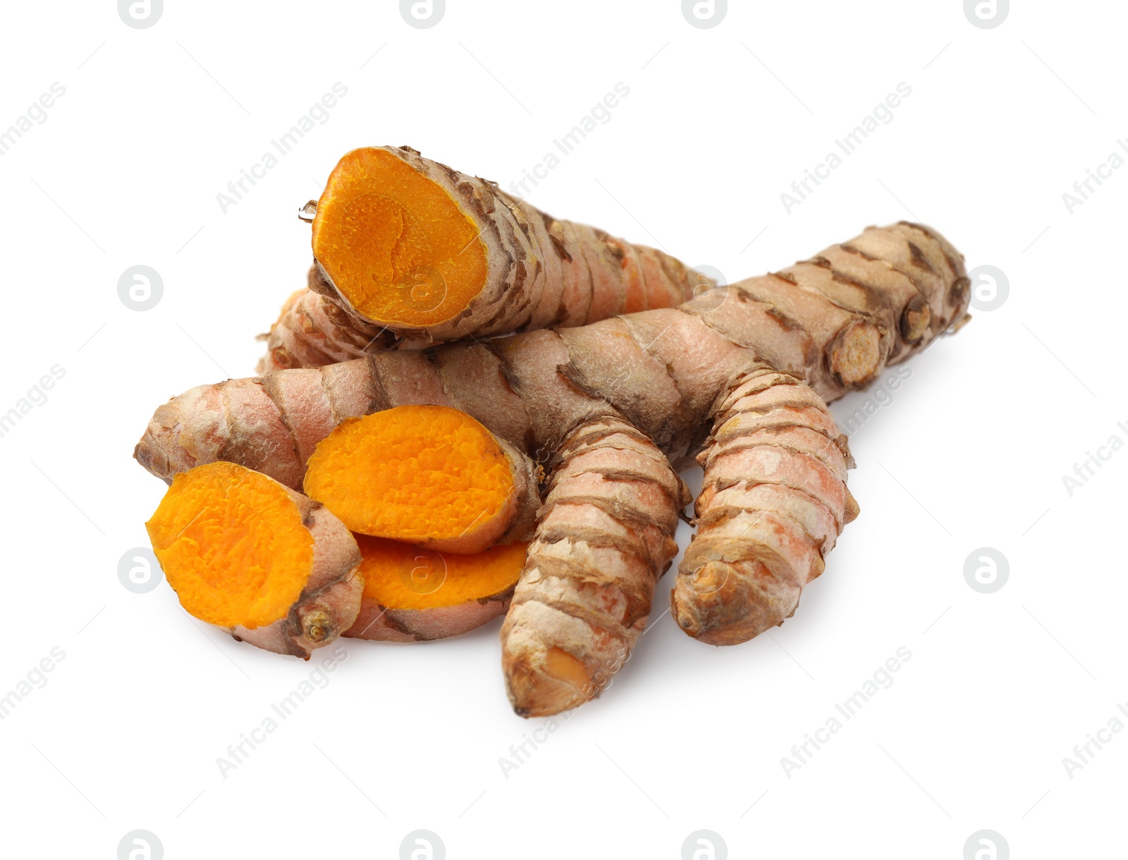 Photo of Whole and cut turmeric roots isolated on white