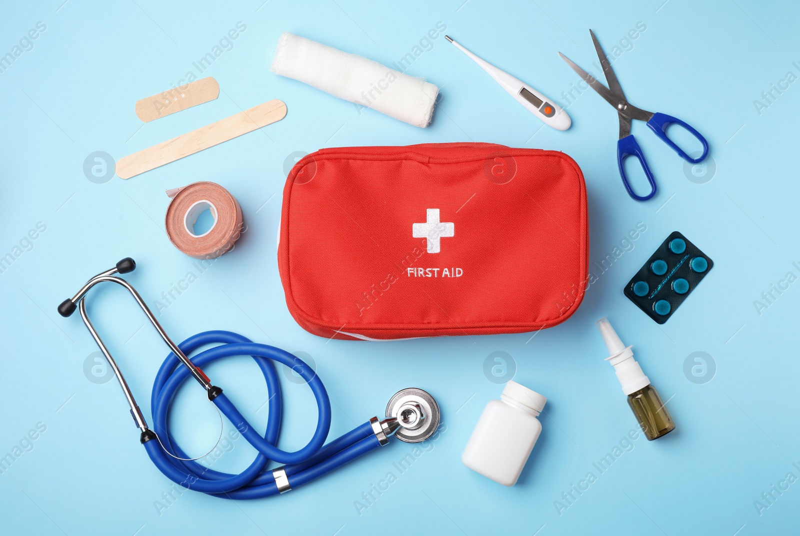 Photo of Flat lay composition with first aid kit on color background