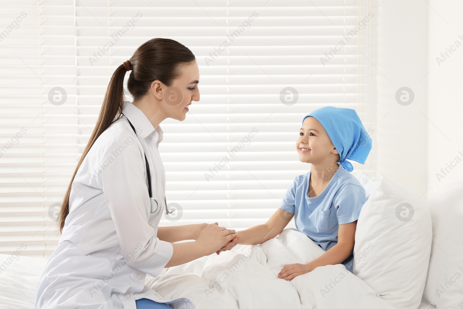 Photo of Childhood cancer. Doctor and little patient in hospital