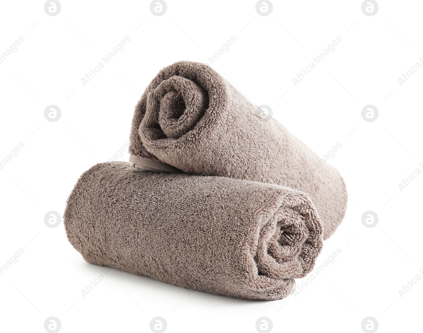 Photo of Fresh soft rolled towels isolated on white