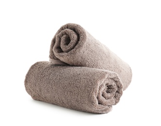 Photo of Fresh soft rolled towels isolated on white