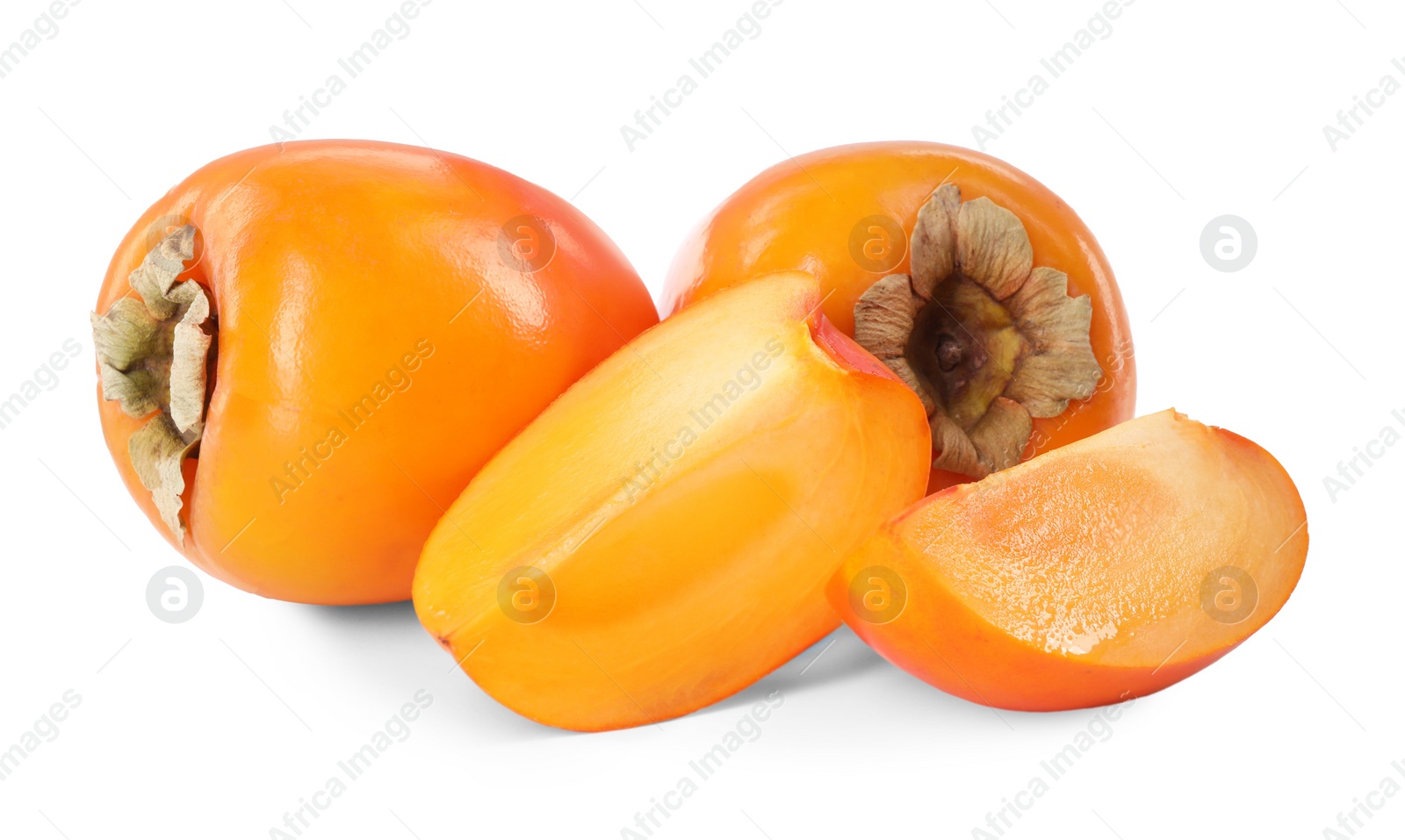 Photo of Whole and cut persimmon fruits isolated on white