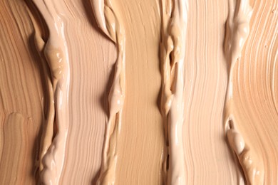 Samples of skin foundation as background, closeup