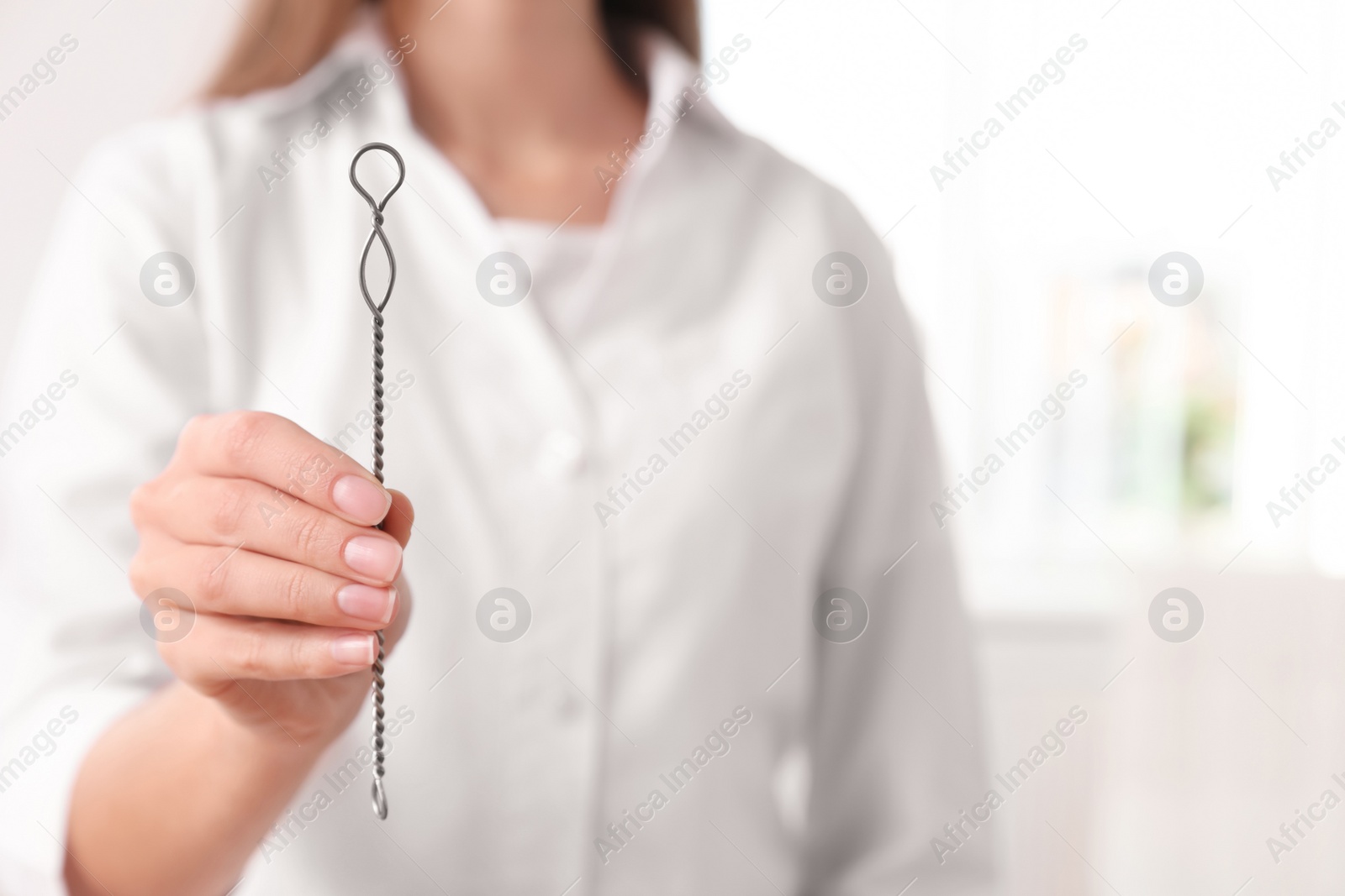 Photo of Speech therapist with logopedic probe in clinic, closeup. Space for text