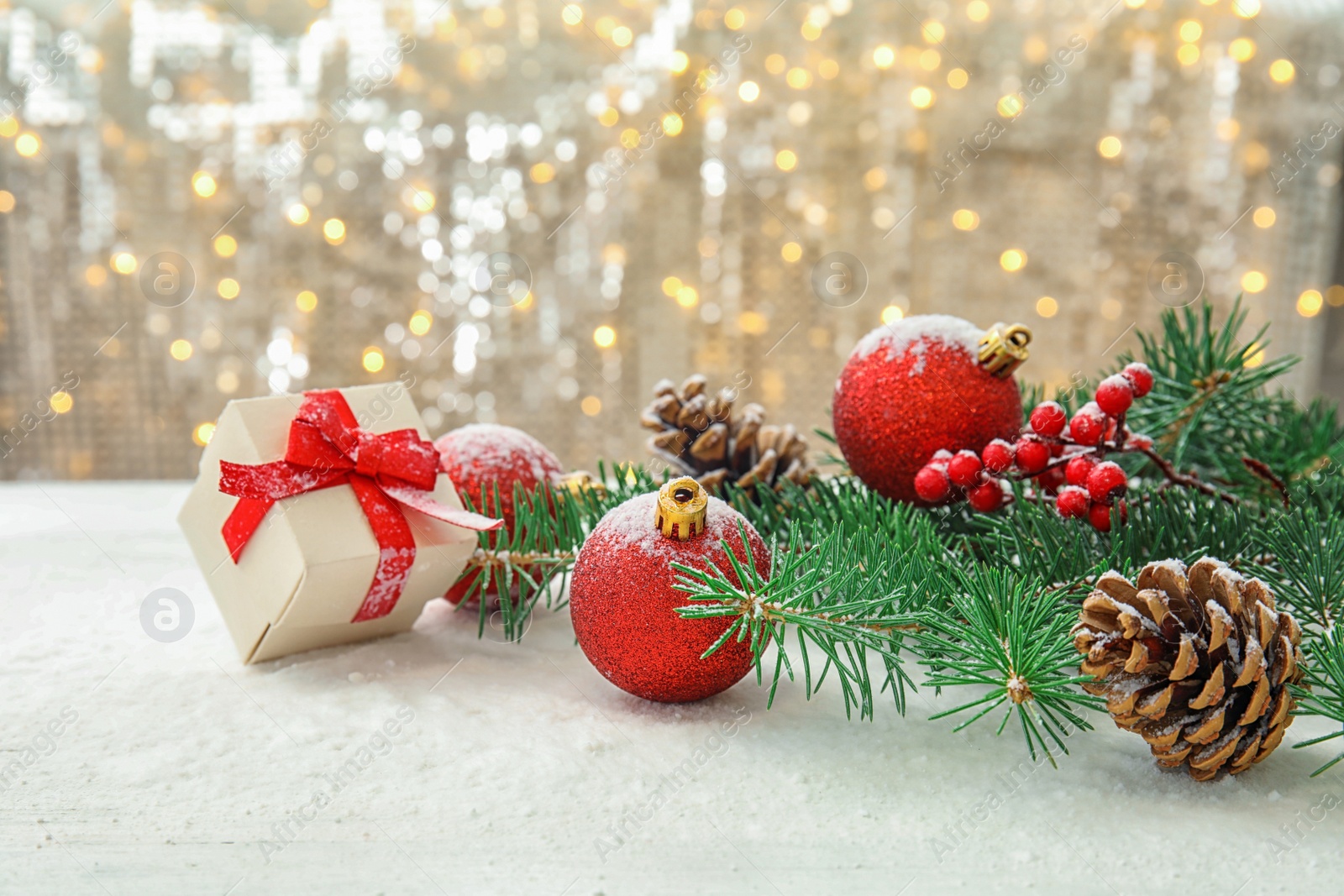 Photo of Beautiful Christmas composition with festive decor and gift box on table