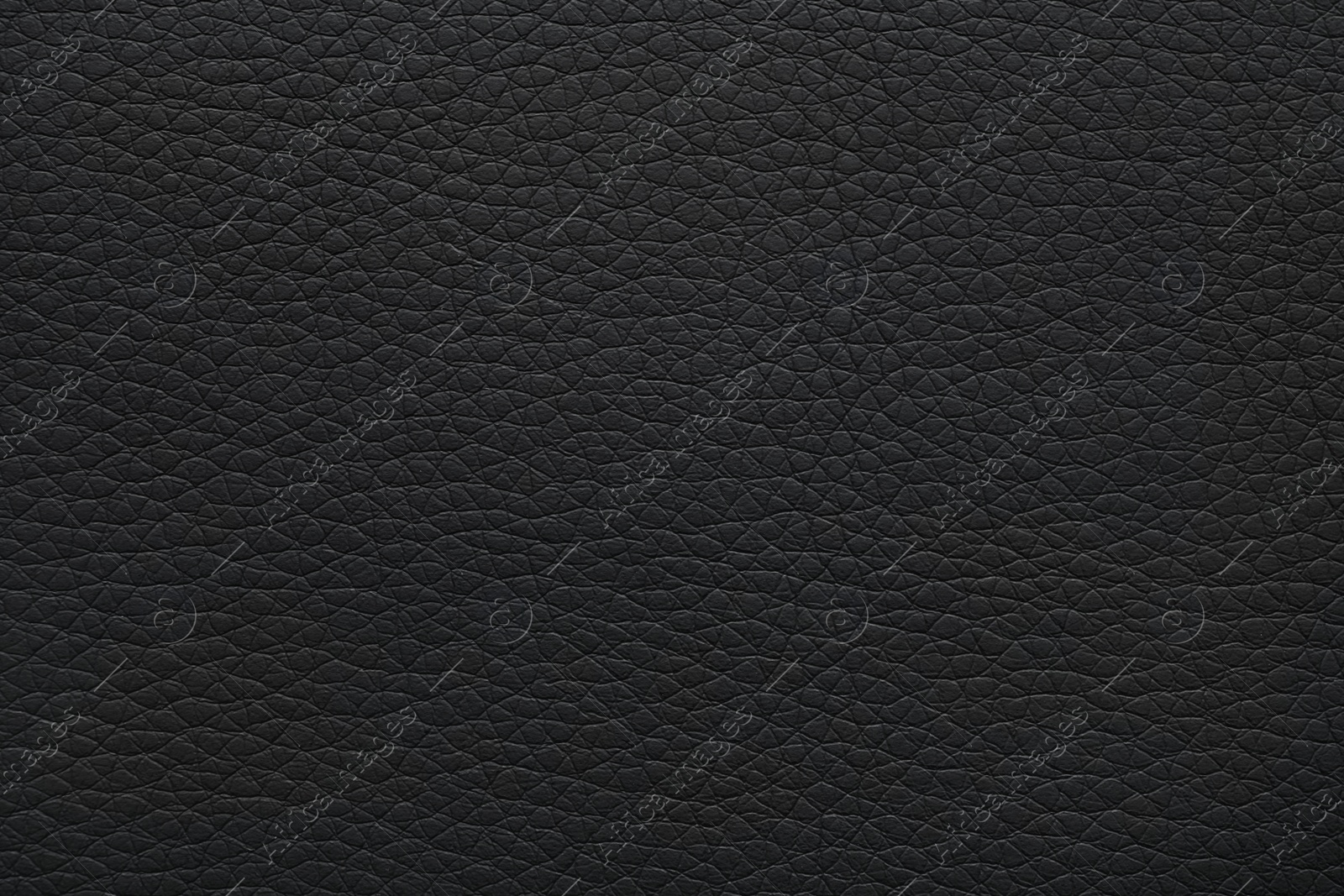 Photo of Texture of black leather as background, closeup