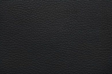 Photo of Texture of black leather as background, closeup