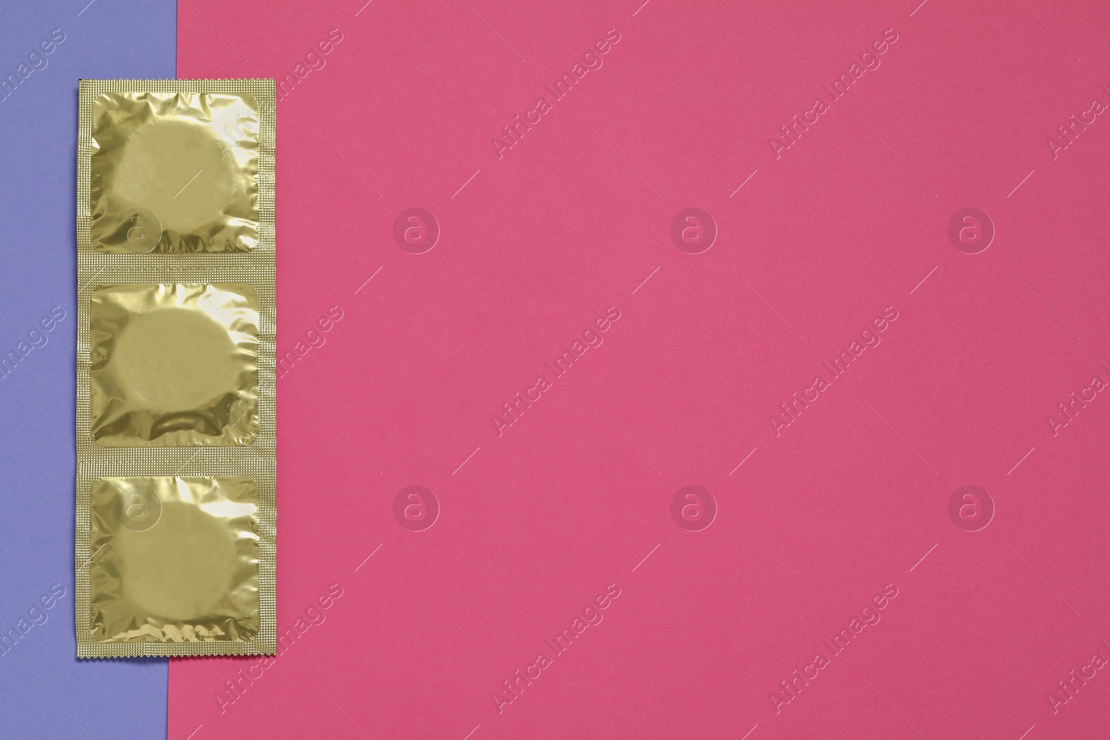 Photo of Condom packages on color background, flat lay and space for text. Safe sex