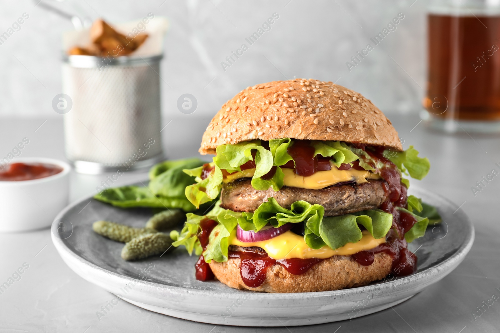 Photo of Plate with tasty burger on table. Space for text