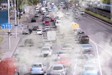 Image of Environmental pollution. Air contaminated with fumes in city. Cars surrounded by exhaust on road