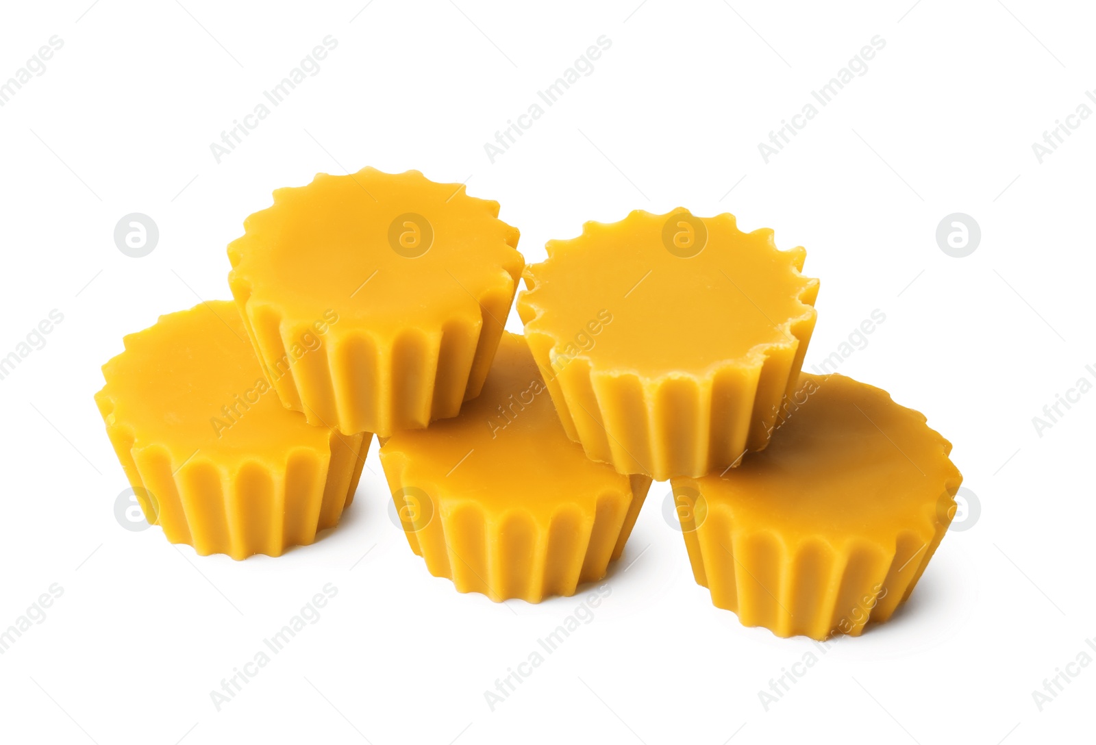 Photo of Natural beeswax cake blocks on white background