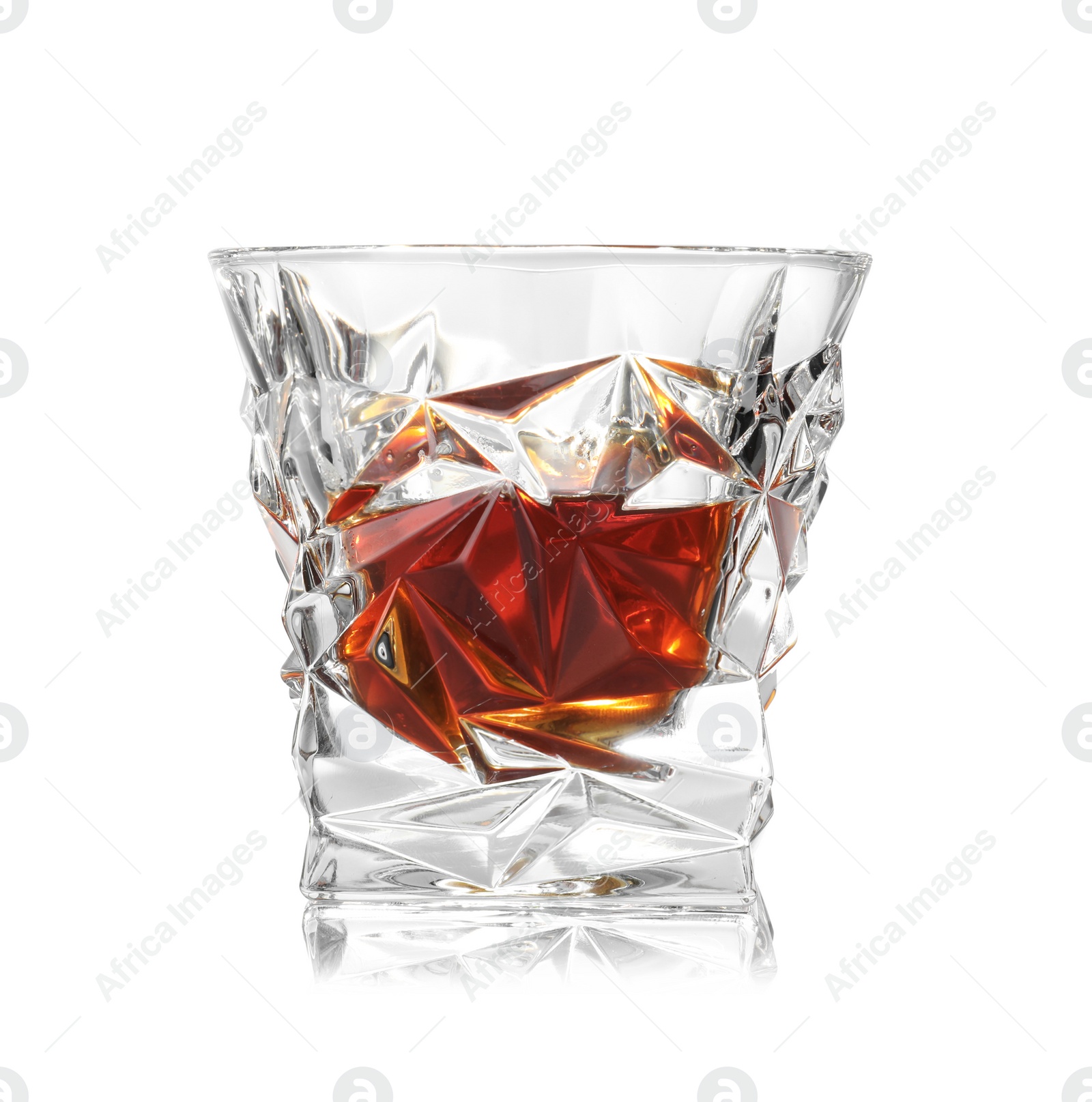 Photo of Glass of scotch whiskey on white background