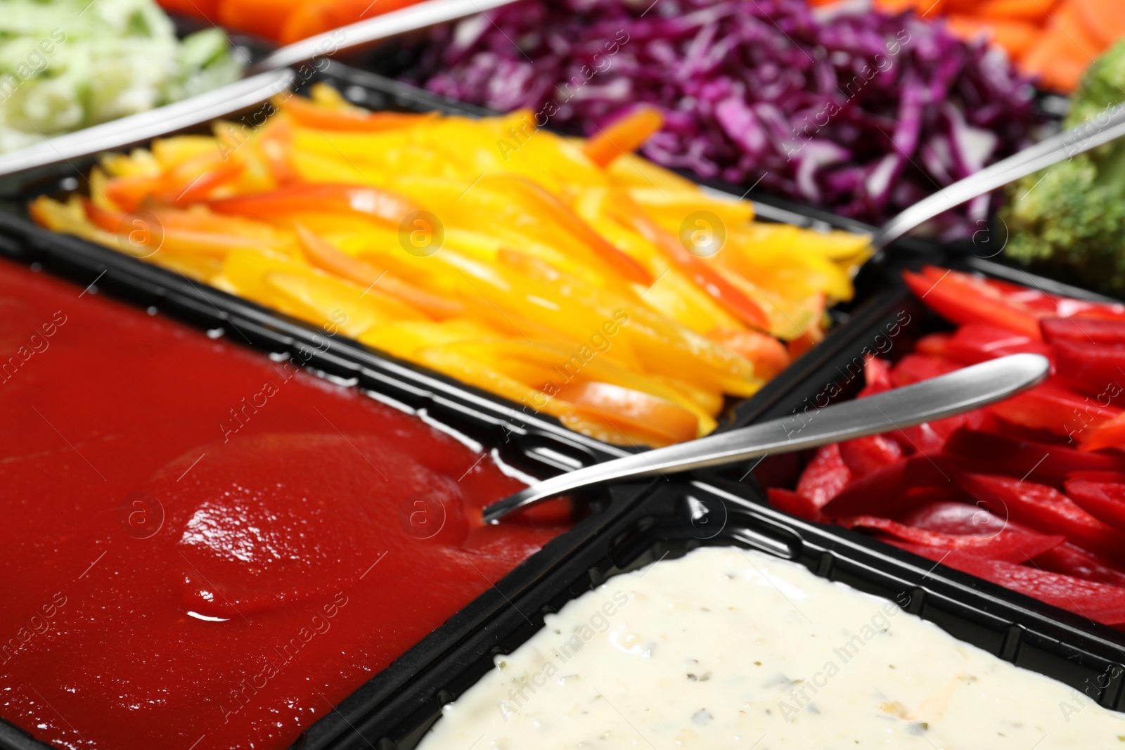 Photo of Salad bar with different fresh ingredients as background, closeup