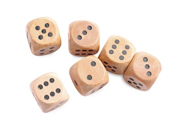 Photo of Many wooden game dices isolated on white, above view