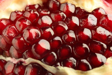 Photo of Ripe juicy pomegranate grains as background, closeup