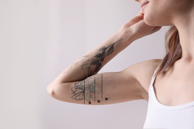 Image of Woman before and after laser tattoo removal procedures on light background, closeup
