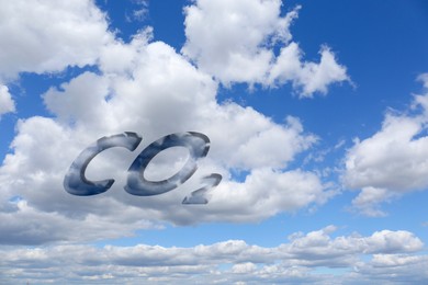 Image of CO2 emissions. Blue sky with white clouds