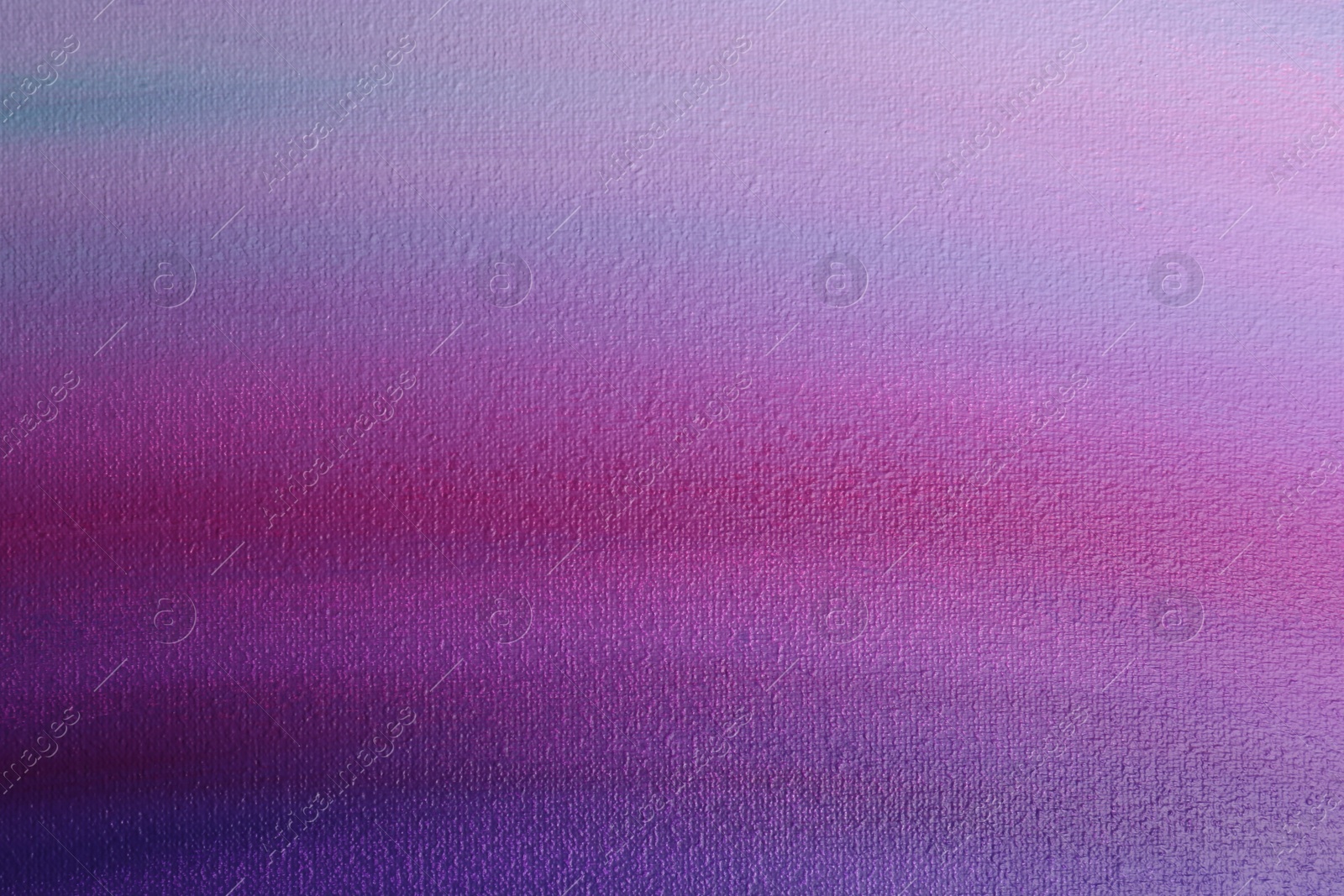 Photo of Canvas with colorful gradient painting, closeup view