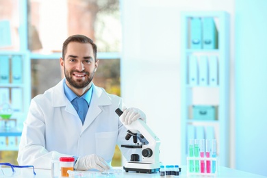 Photo of Young scientist working in laboratory, space for text. Chemical analysis