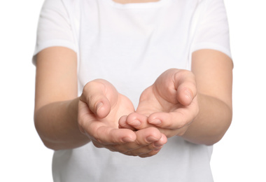 Woman against white background, closeup on hands