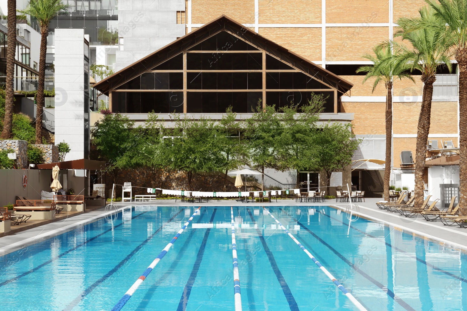 Photo of View on swimming pool and building at luxury resort