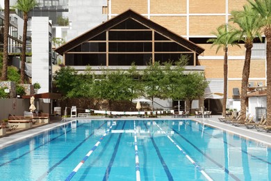 Photo of View on swimming pool and building at luxury resort