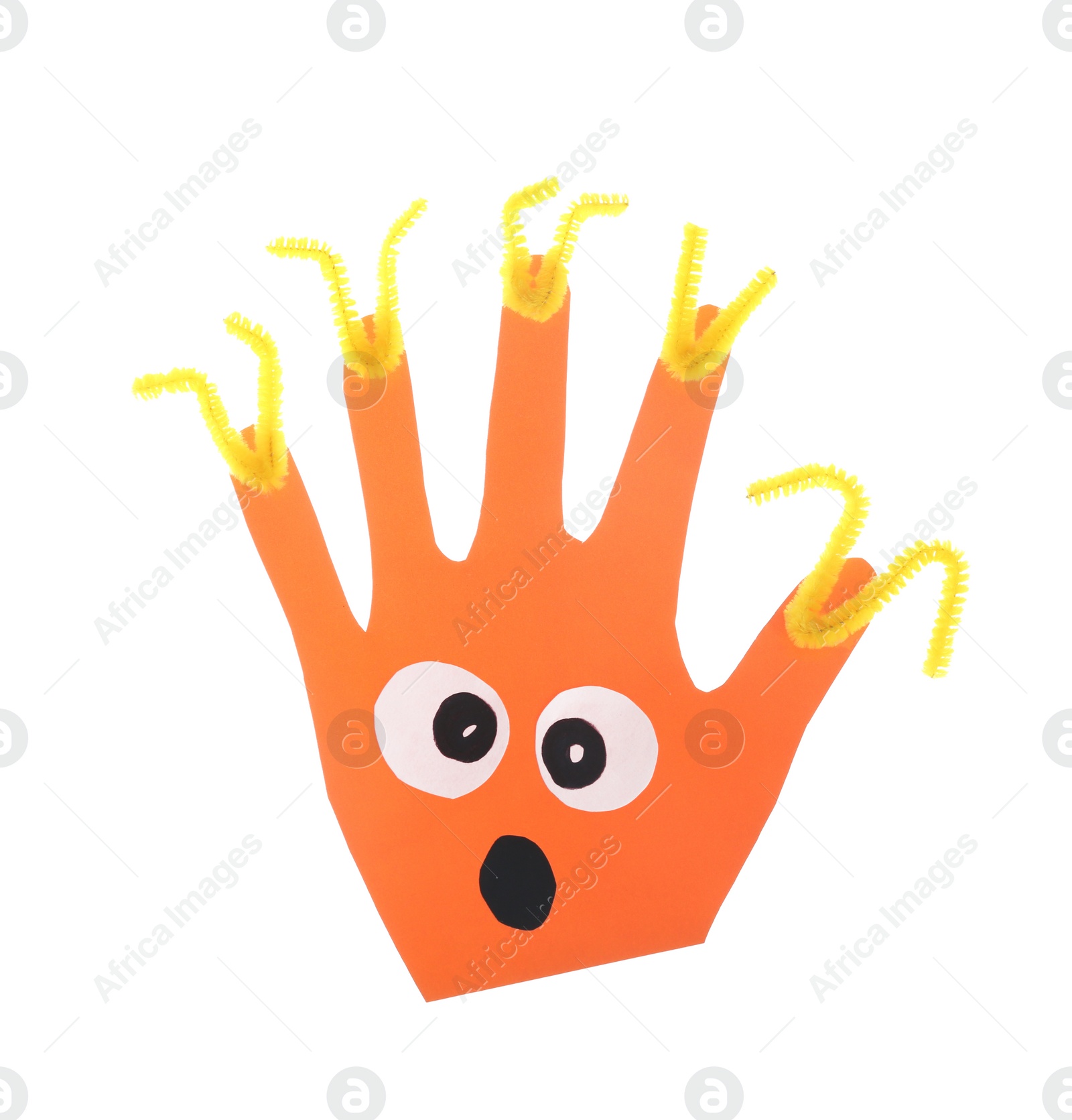Photo of Funny orange hand shaped monster isolated on white, top view. Halloween decoration