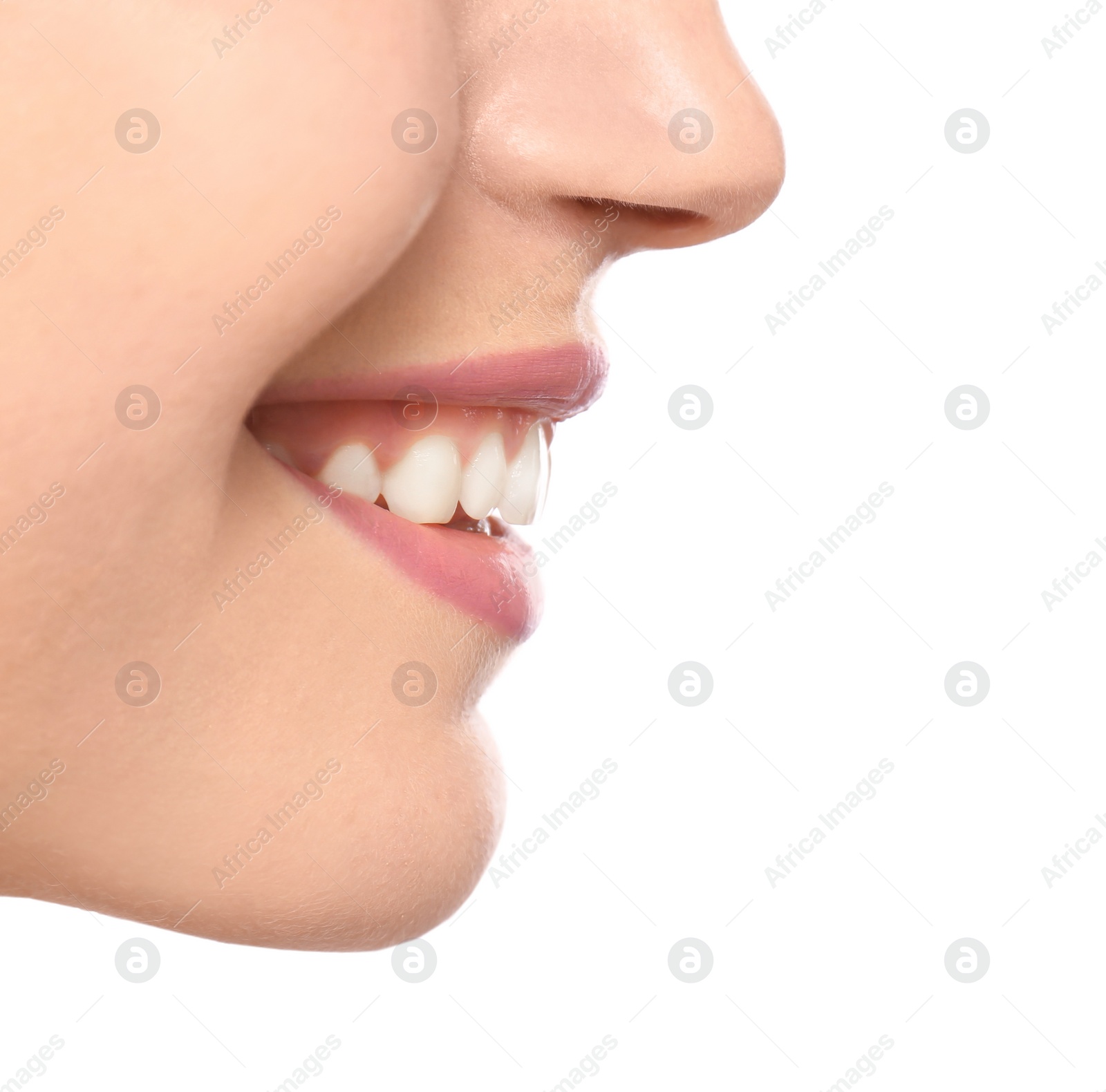 Photo of Young woman with beautiful smile on white background, closeup. Teeth whitening