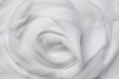 Photo of Texture of white shaving foam as background, top view