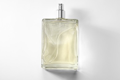 Luxury men`s perfume in bottle on white background, top view