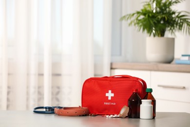 Photo of First aid kit on table indoors, space for text
