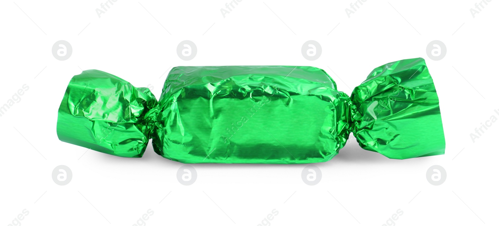 Photo of Tasty candy in green wrapper isolated on white