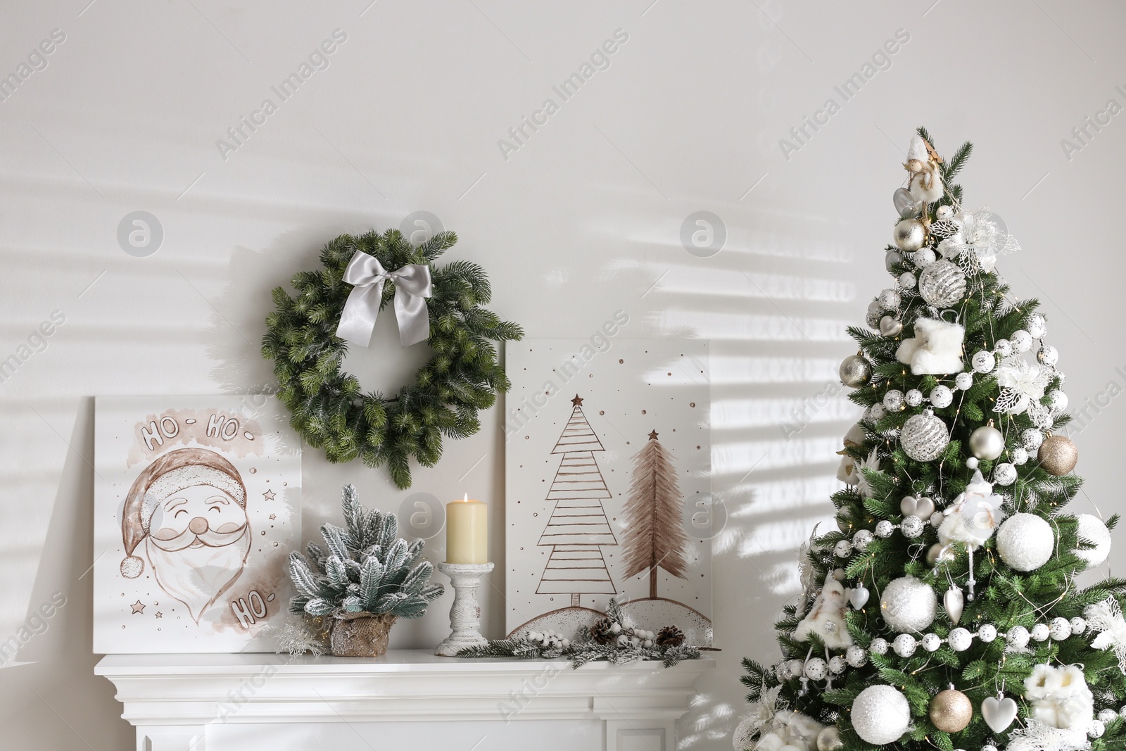 Photo of Beautiful Christmas pictures in festive room interior