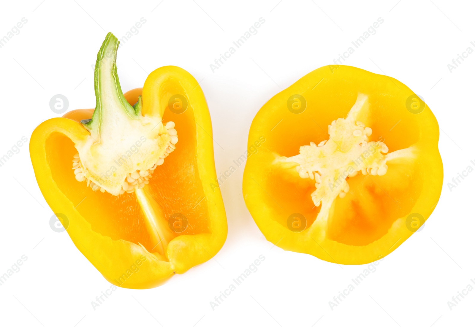 Photo of Cut yellow bell peppers isolated on white, top view
