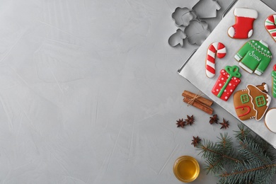 Flat lay composition with delicious homemade Christmas cookies on grey table. Space for text