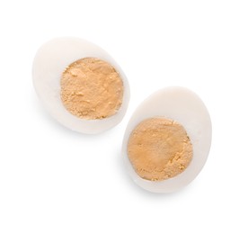 Halves of fresh hard boiled egg on white background, top view