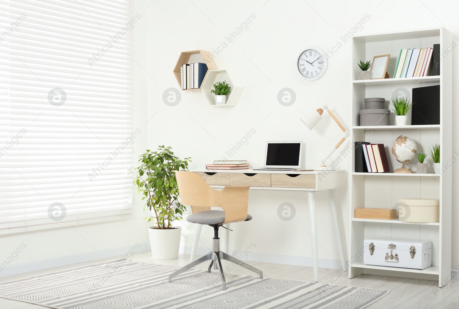 Photo of Beautiful workplace with comfortable desk and chair at home