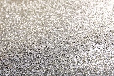 Photo of Closeup view of sparkling silver glitter background