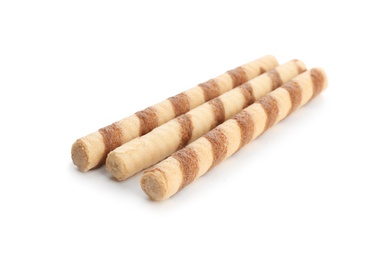 Photo of Delicious wafer rolls on white background. Sweet food