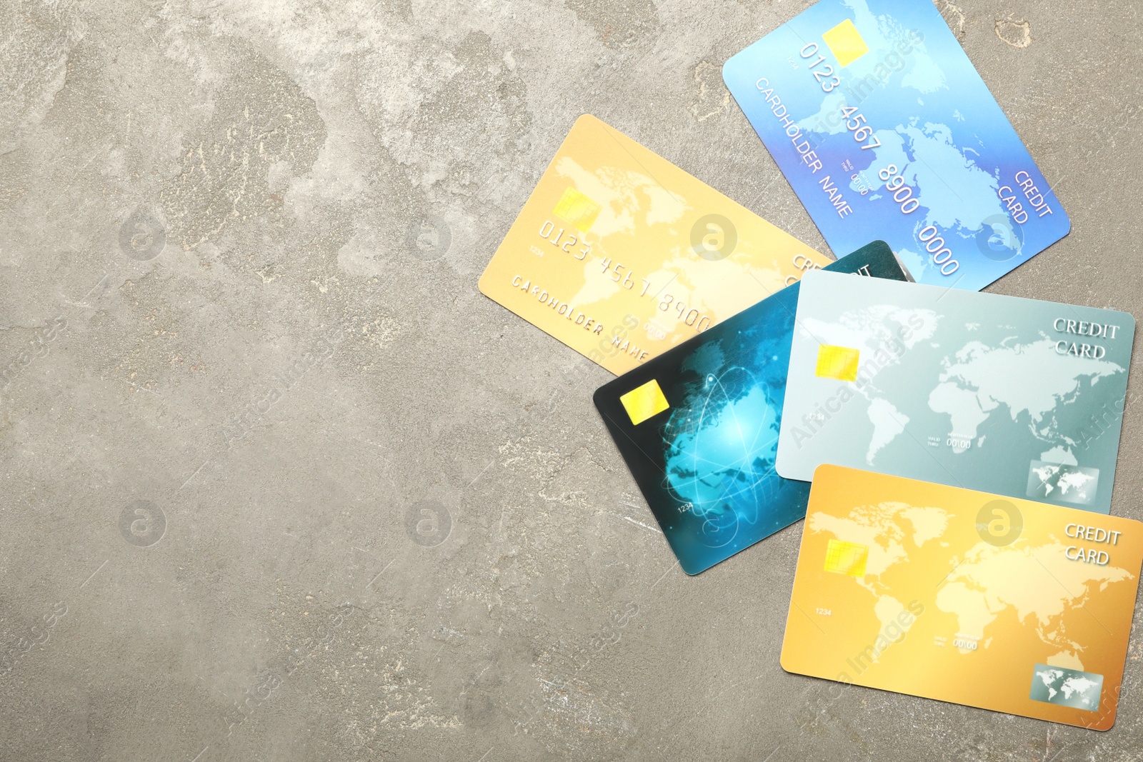 Photo of Many different credit cards on grey background, flat lay. Space for text