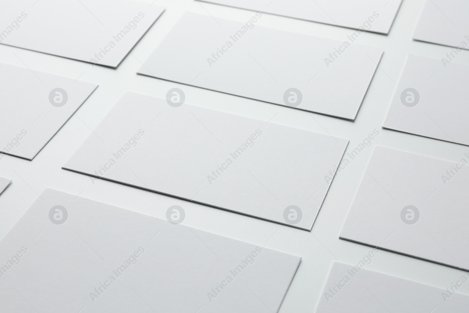 Photo of Blank business cards on white background, closeup. Mockup for design