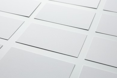 Photo of Blank business cards on white background, closeup. Mockup for design