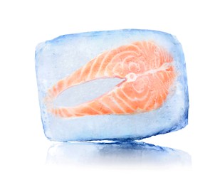 Image of Frozen food. Raw salmon steak in ice cube isolated on white