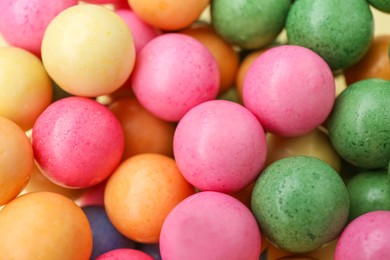 Photo of Many bright chewy gumballs as background, closeup