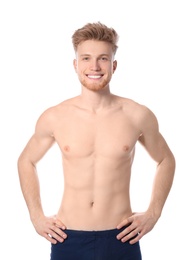 Portrait of young man with slim body on white background