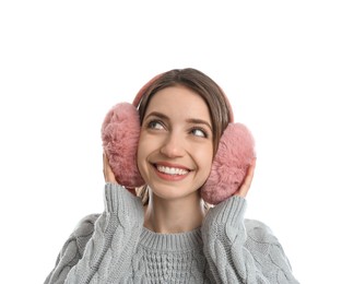 Photo of Happy woman wearing warm earmuffs on white background